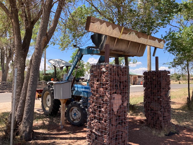 Wood Beam being hoisted up by Roy Taylor using a tractor